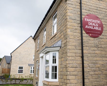 A sign advertising deals on new-build houses in Holmfirth, Britain, 29 September 2022.