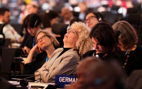 A couple of members of the German delegation take a second to collect their thoughts – with their eyes shut.
