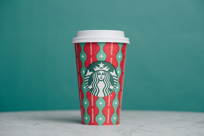 One of Starbucks' four holiday cups for 2022. Called Gift Wrap Magic, the cup is red and green with "wavy ribbons and shimmering sparkles" to resemble gift wrap.