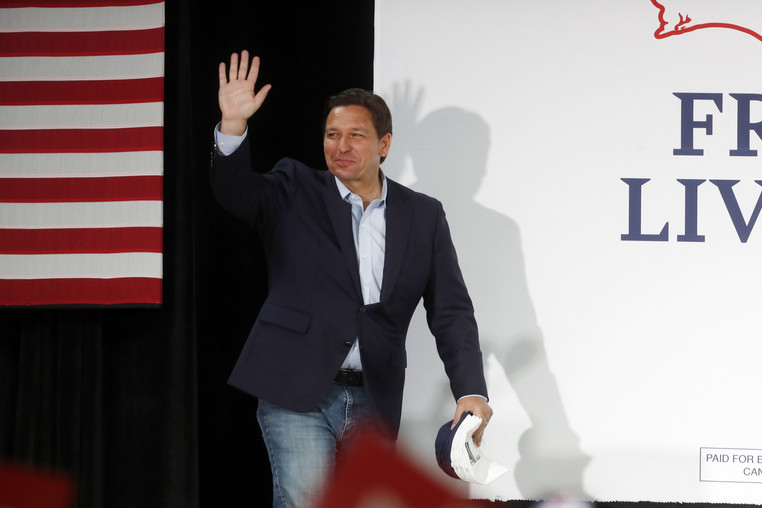 Gov. Ron DeSantis (R-Fla.) walks on stage to give a campaign speech.