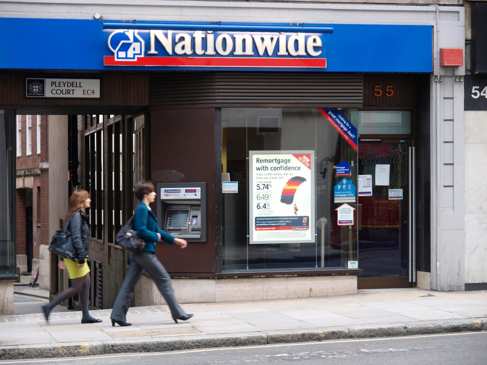 Nationwide mortgage shop with ATM and passing people Pleydell Court London UK. Interest rates have lifted mortgage costs