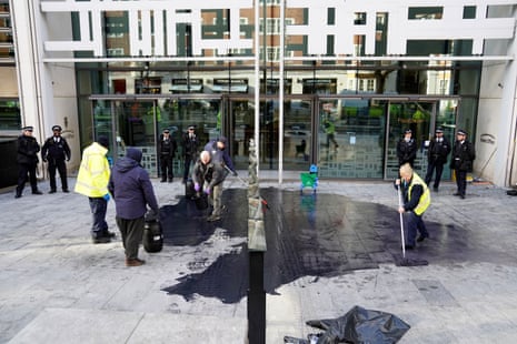 Black paint on the pavement outside the Home Office and the Department for Levelling Up, Housing & Communities in London after the Extinction Rebellion protest.