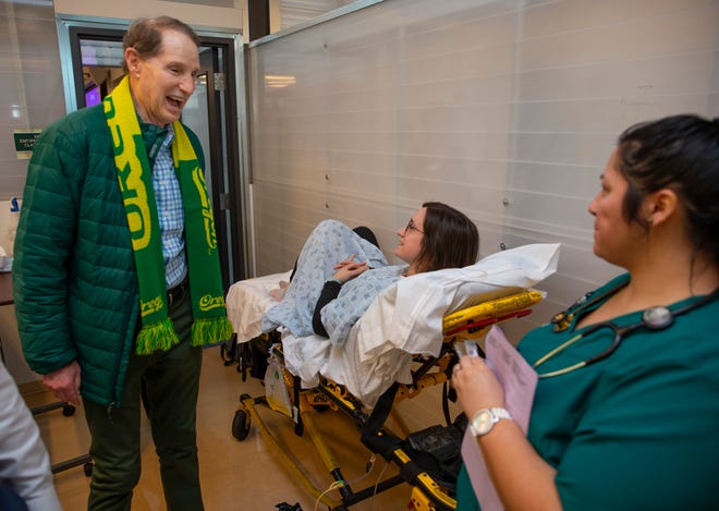 U.S. Sen. Ron Wyden (D-Oregon), left, meets with nursing students Alli Morris, center, and Pauline Barnett while taking a tour of Lane Community College Wednesday.