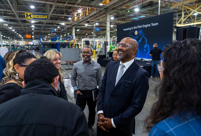 General Motors EVP of Global Manufacturing & Sustainability Gerald Johnson, right, speaks with people at General Motors Flint Engine South in Flint on Friday, Jan. 20, 2023, after a news conference talking about General Motors investing $918 million in four U.S. plants for expanded V-8 engine production in light-duty full-size pickups and large SUVs as well as component parts for electric vehicles. As part of the investment, two plants in Michigan will receive new products to build: Flint Engine Operations and Bay City Powertrain facilities.