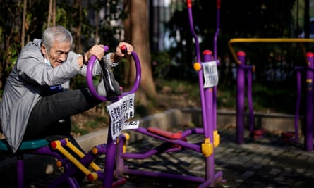 An elderly man works out on an exercise machine at a park in Shanghai.