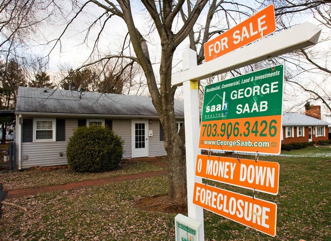 A home for sale is seen January 24, 2008 in Manassas, Virginia. The mortgage crisis has created a new industry for developers buying foreclosed or auctioned homes at cheap prices, then reselling them for a profit.  