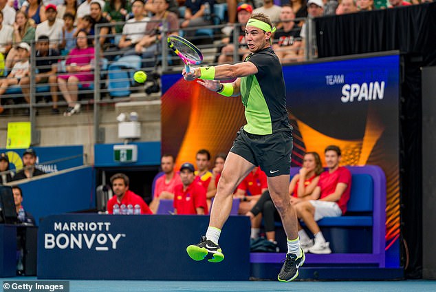 Nadal is pictured playing a forehand during his shock defeat to Cameron Norrie