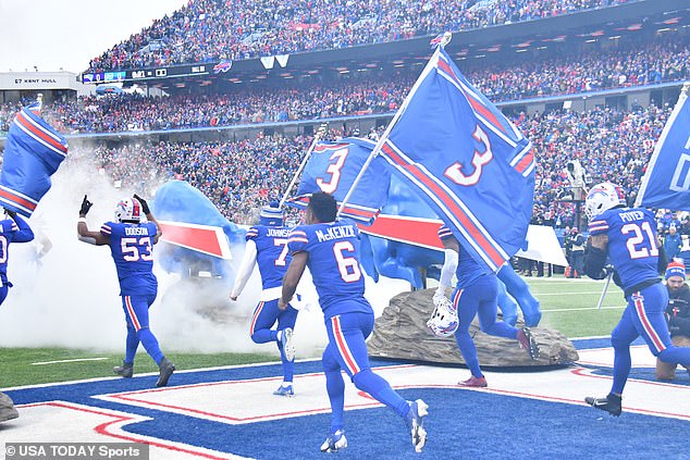 Bills players came out of the tunnel waving 'Pray for Damar' and number three flags