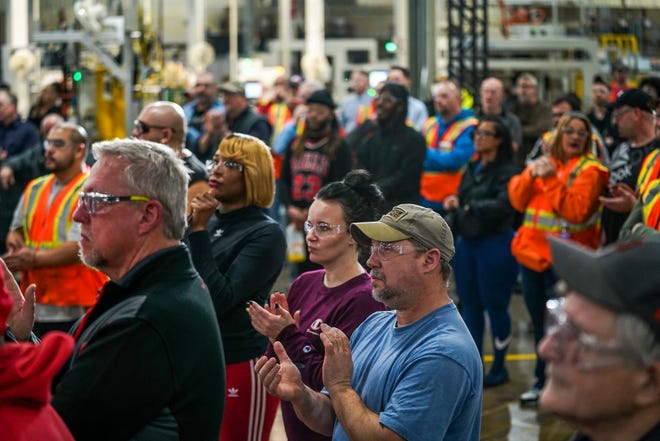 Employees at General Motors Flint Engine South in Flint listen to speakers announcing General Motors investing $918 million in four U.S. plants on Friday, Jan. 20, 2023, at the plant in Flint.