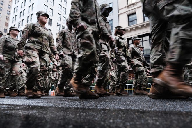 Military personnel march in the annual Veterans Day Parade in New York City in 2022.