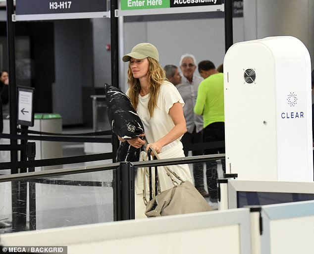 The model carried with her a pillow inside a customized cover with her initial on it