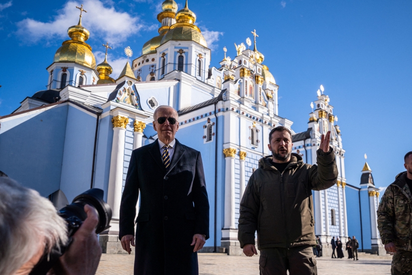 US President Joe Biden (L) walks next to Ukrainian President Volodymyr Zelensky (2nr R) in front of St. Michaels Golden-Domed Cathedral as he arrives for a visit in Kyiv on February 20, 2023. - US President Joe Biden made a surprise trip to Kyiv on February 20, 2023, ahead of the first anniversary of Russia's invasion of Ukraine, AFP journalists saw. Biden met Ukrainian President Volodymyr Zelensky in the Ukrainian capital on his first visit to the country since the start of the conflict. (Photo by Dimitar DILKOFF / AFP) (Photo by DIMITAR DILKOFF/AFP via Getty Images)