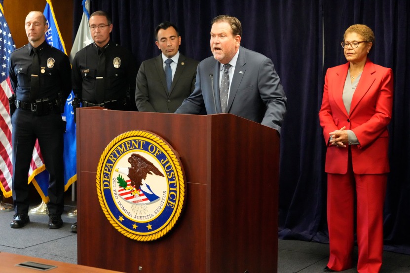 Jeffrey Abrams, Regional Director of Anti-Defamation League, ADL Los Angeles, at podium, denounces anti-Semitism and hate crimes at a news conference at the U.S. Attorney's Office Central District of California offices in Los Angeles Friday, Feb. 17, 2023. From left, United States Attorney Martin Estrada and Los Angeles Mayor Karen Bass.