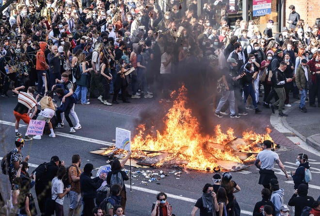 Protesters gather during a demonstration in Toulouse, southern France, on March 28, 2023.