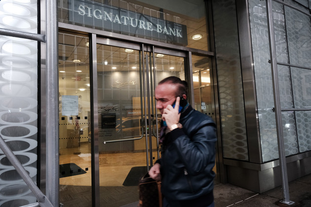 NEW YORK, NEW YORK - MARCH 13: People walk by a Manhattan branch of Signature Bank which was closed by bank regulators on Sunday on March 13, 2023 in New York City. The move by the  state's Department of Financial Services seeks to prevent a banking crisis spurred by the failure of Silicon Valley Bank. (Photo by Spencer Platt/Getty Images)
