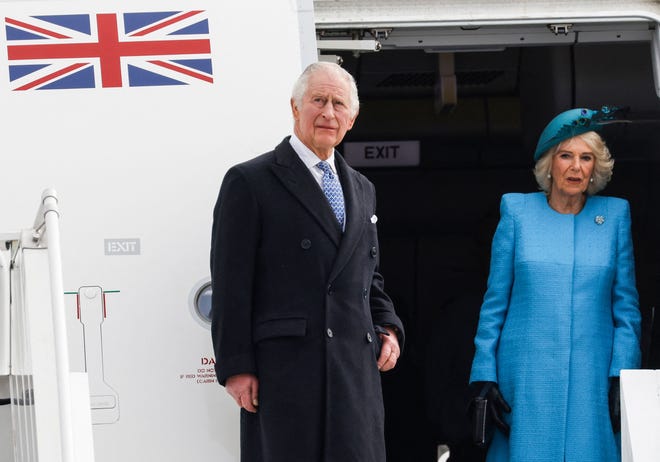 Britain's King Charles III and Britain's Camilla, Queen Consort get off their plane after landing at Berlin Brandenburg Airport on March 29, 2023.