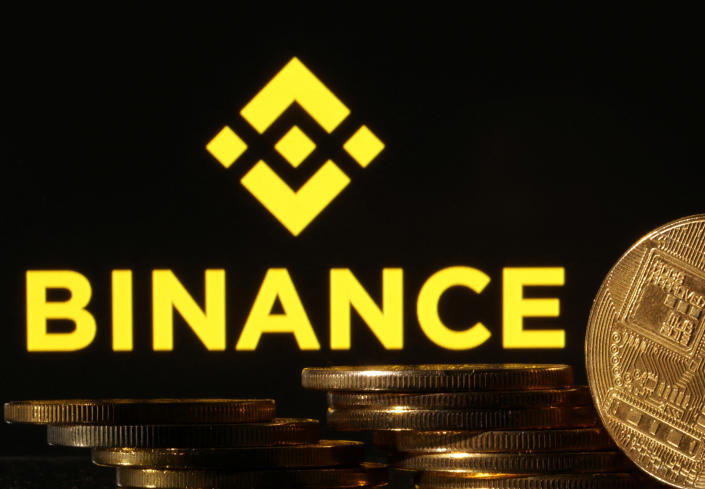 Representations of cryptocurrencies are seen in front of displayed Binance logo in this illustration taken November 10, 2022. REUTERS/Dado Ruvic/Illustration