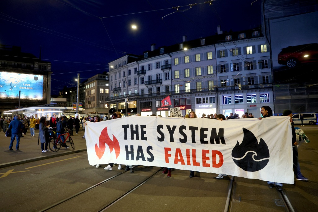 People demonstrate against the buying of Swiss bank Credit Suisse by UBS.