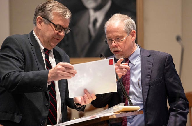 Prosecutors John Meadors (left) and Creighton Waters look over evidence in Alex Murdaugh’s trial for murder at the Colleton County Courthouse on Friday, Feb. 10, 2023.