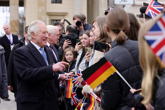 King Charles III greets the crowd during the Ceremonial welcome at Brandenburg Gate on March 29, 2023 in Berlin, Germany. 76