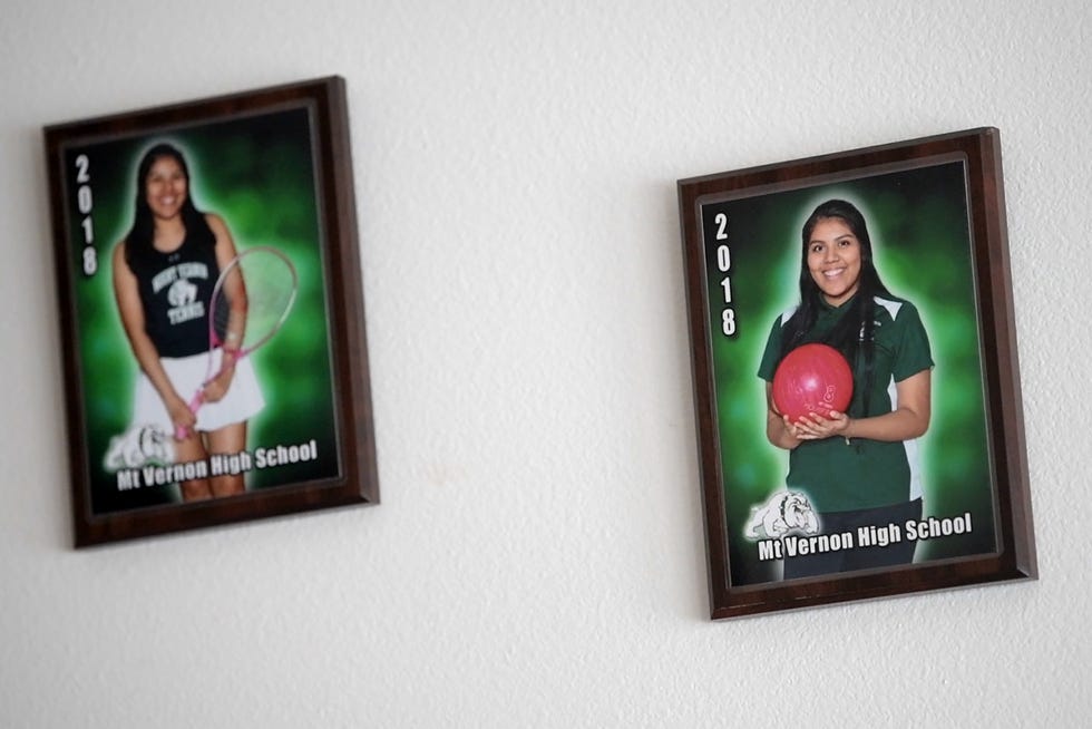 Portraits of Guillermina Gutierrez-Martinez hang in her childhood home in Mount Vernon, Wash. Gutierrez-Martinez is one of hundreds of first-generation college students who have had to navigate higher education during the COVID-19 pandemic.