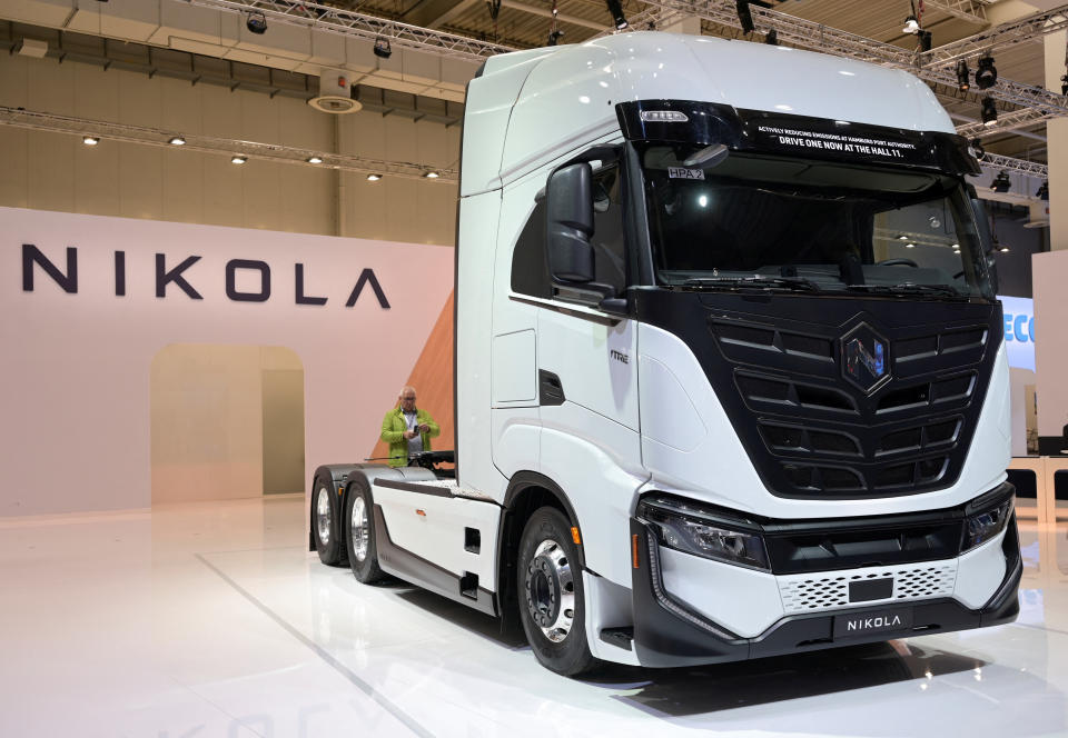 A member of the media stands behind a hydrogen-powered Artic truck at the booth of U.S. truckmaker Nikola at the IAA Transportation fair, which will open its doors to the public on September 20, 2022, in Hanover, Germany, September 19, 2022. REUTERS/Fabian Bimmer