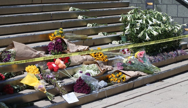 The scene outside the Old National Bank is one of remembrance for five people killed Monday when a former employee opened fire inside the office. He was shot and killed by police.April 11, 2023  