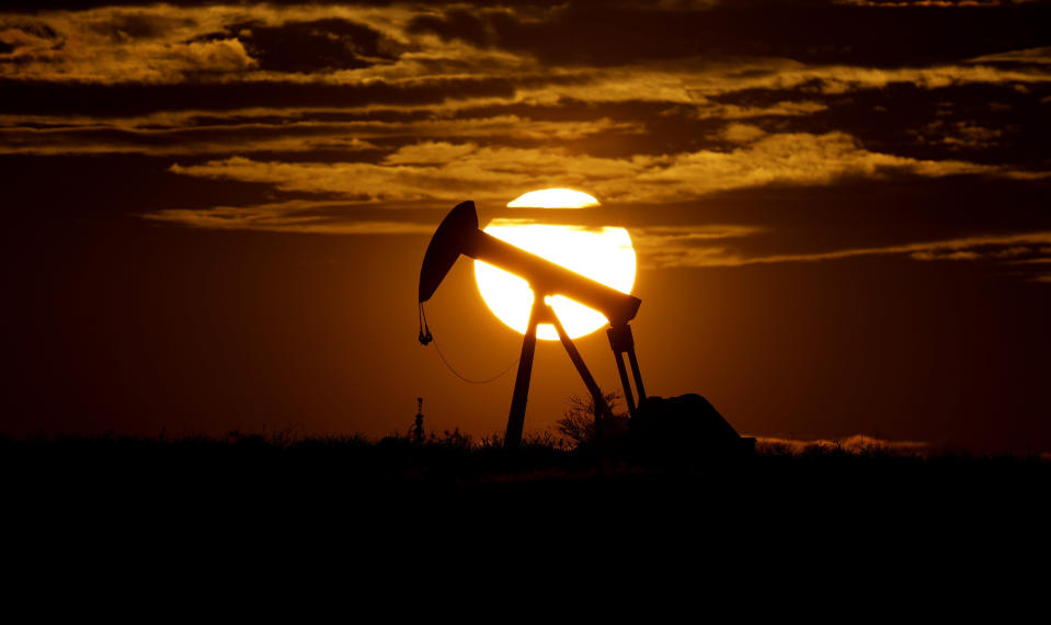 FILE - The sun sets behind an idle pump jack near Karnes City, USA, April 8, 2020.  Oil markets have been fluctuating over fears of lost supplies from Russia because of the war in Ukraine. But the alliance of OPEC members and allied oil-producing countries are likely to steer a steady course when they decide production levels at an online meeting Thursday. The OPEC+ alliance has been opening the taps only gradually to restore cuts made during the worst of the pandemic recession. (AP Photo/Eric Gay, File)