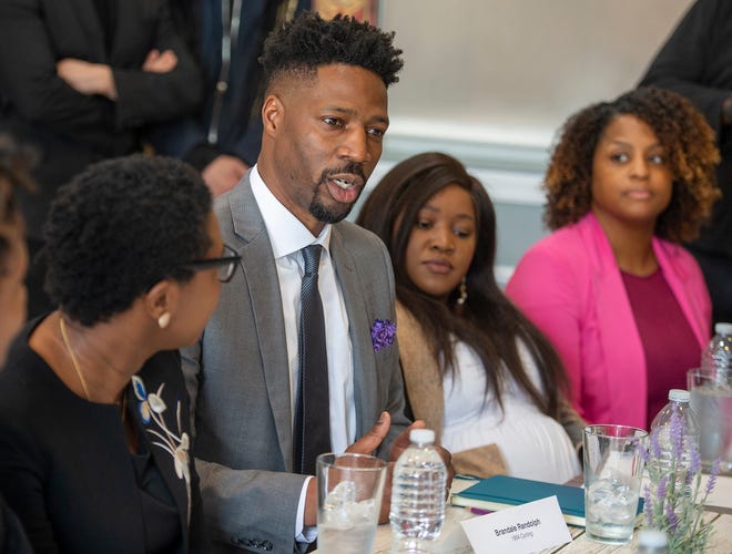 Brandale Randolph, founder of The 1854 Cycling Company in Framingham, speaks with local, state and federal officials and other Black business owners at the Nzuko Restaurant in Framingham, April 24, 2023.