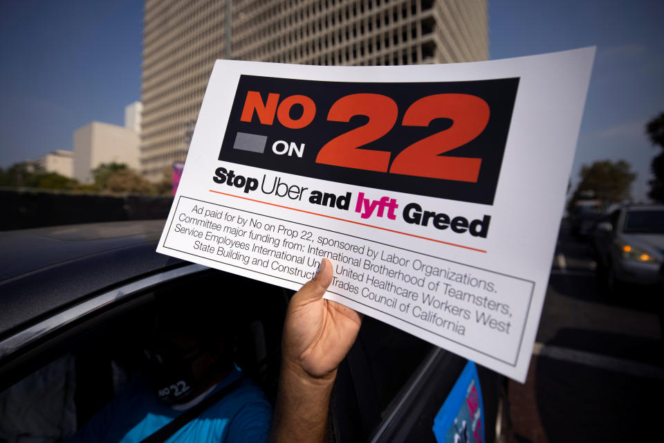App-based gig workers hold demonstration outside Los Angeles City Hall to urge voters to vote no on Proposition 22, a November ballot measure that would classify app-based drivers as independent contractors and not employees or agents, in Los Angeles, California, U.S., October 8, 2020.  REUTERS/Mike Blake