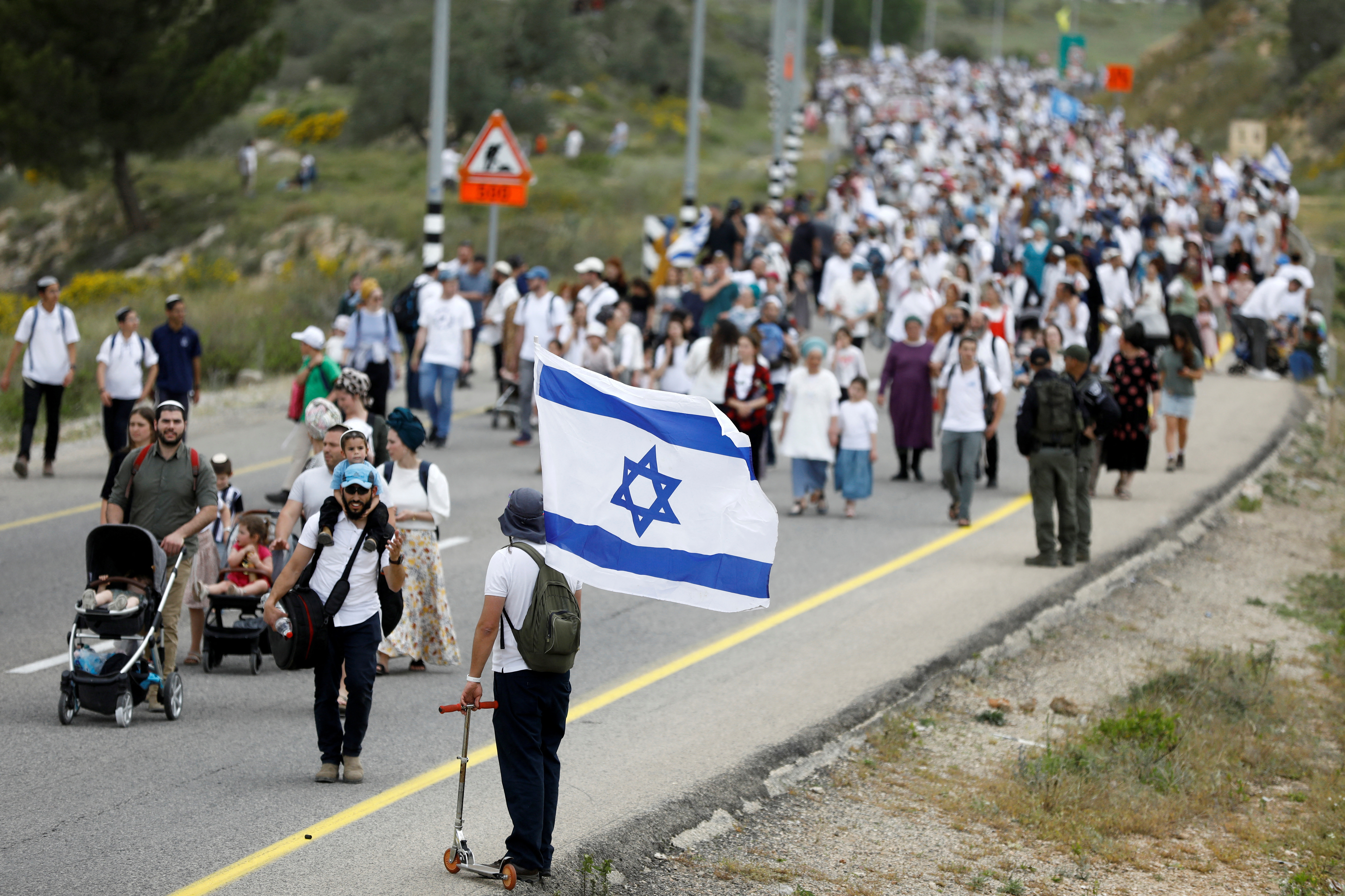 Israeli settlers hold a protest march in West Bank