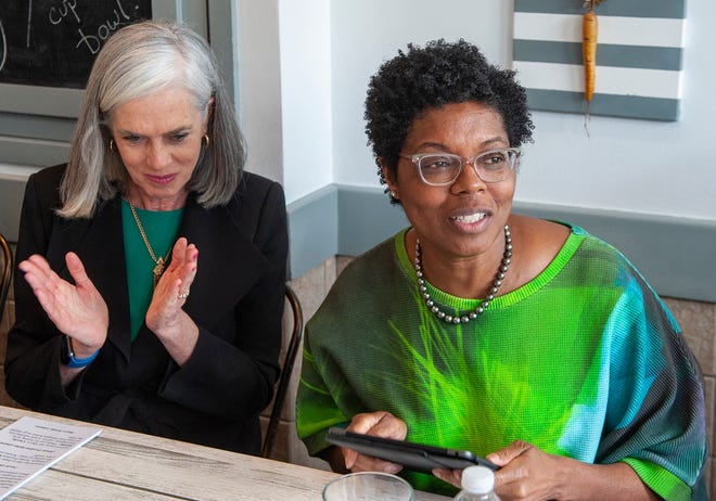 Nicole Obi, right, president and CEO of the Black Economic Council of Massachusetts, and U.S. Rep. Katherine Clark, D-Mass., meet with local Black business owners at the Nzuko Restaurant in Framingham, April 24, 2023.