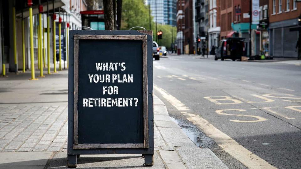The words &quot;what's your plan for retirement&quot; written on chalkboard on pavement somewhere in London