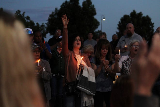 Community members sing during a prayer vigil at Hills Church, Monday, May 15, 2023, in Farmington, New Mexico.