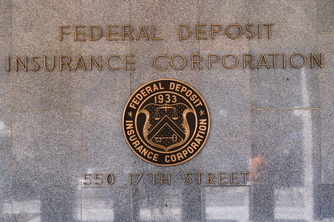 The Federal Deposit Insurance Corporation (FDIC) seal is shown outside its headquarters, Tuesday, March 14, 2023.