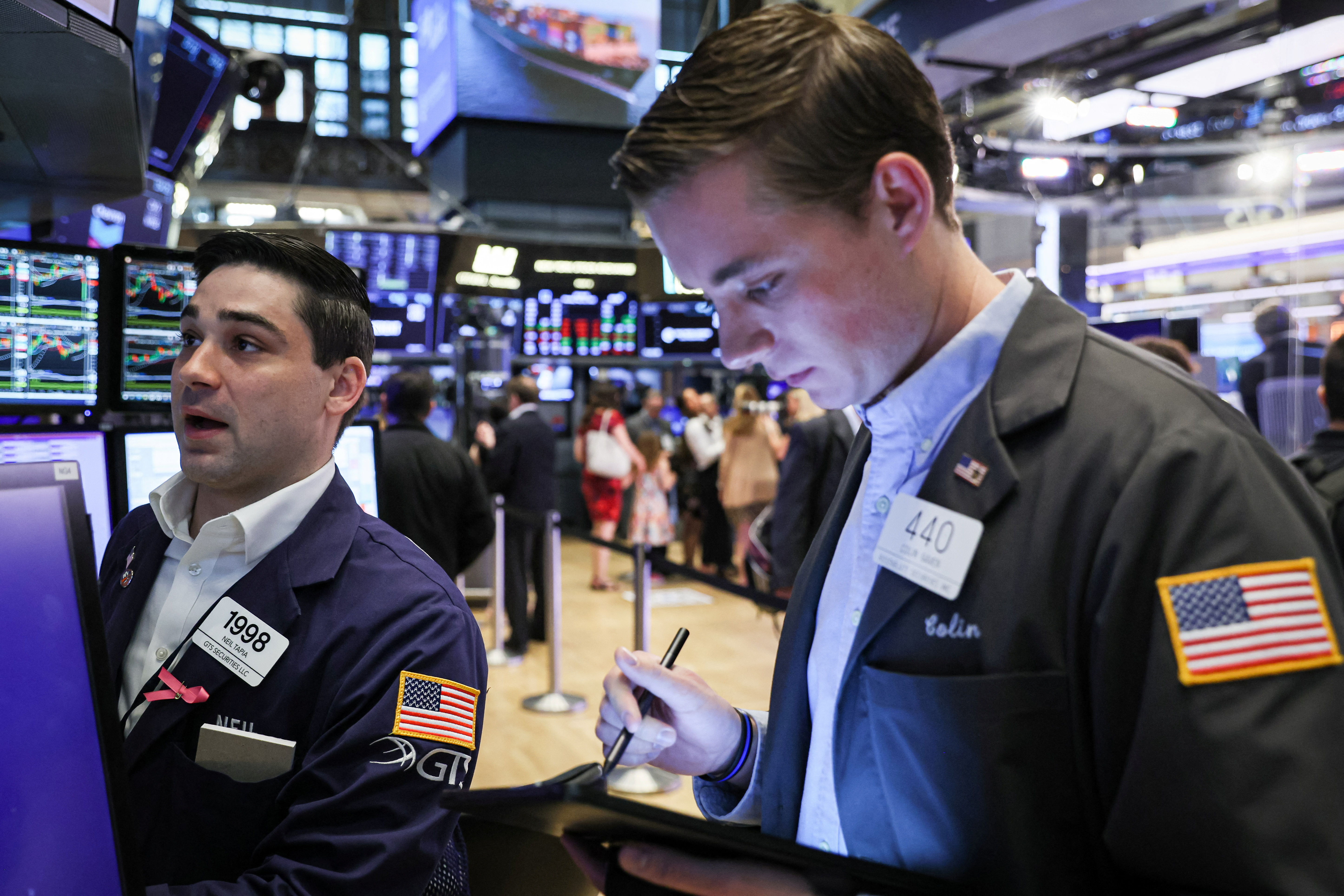 Traders work on the floor of the NYSE in New York