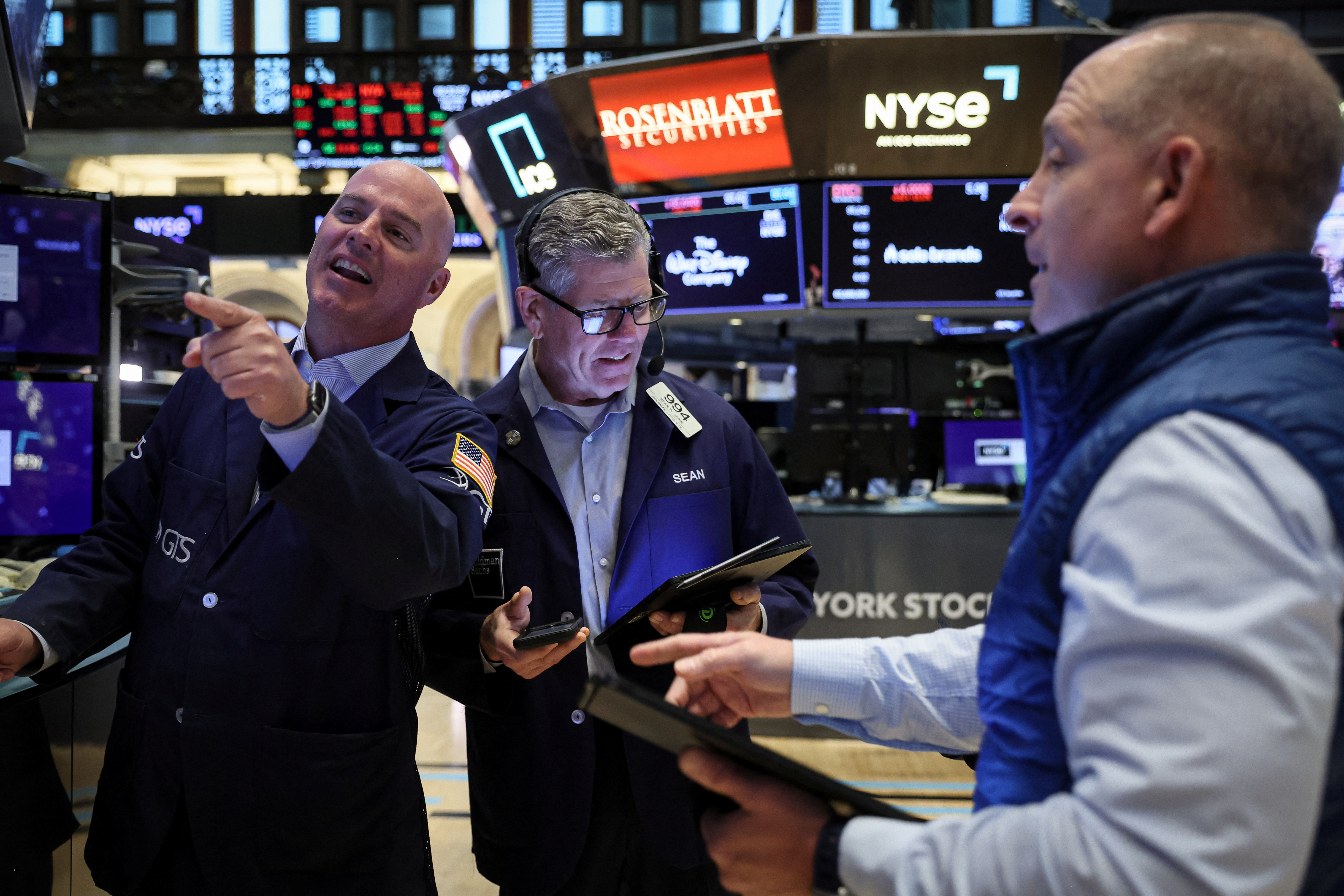 Traders work on the floor of the NYSE in New York