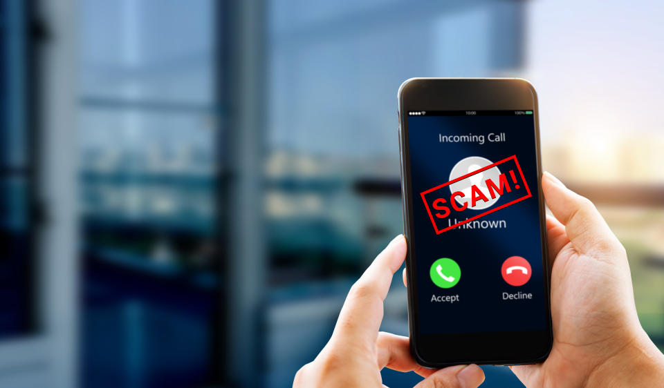 Unknown caller show on mobile phone screen, illustrating a story on the OCBC phishing scam.