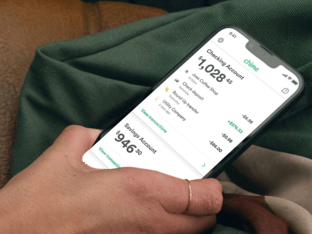 Person holding smartphone with Chime app active
