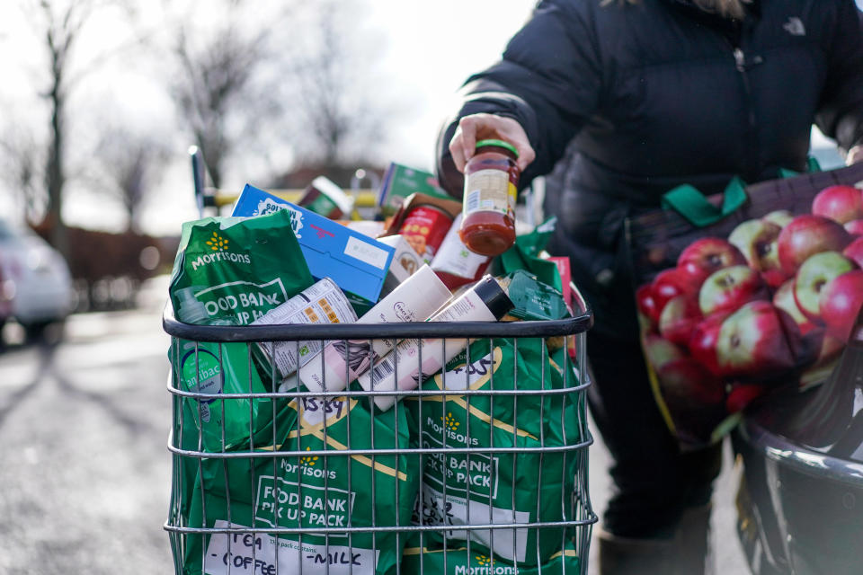 EDINBURGH, SCOTLAND - FEBRUARY 21: Val Reid, a volunteer with Community for Food, is seen unpacking donations from Morrisons supermarket on February 25, 2022 in Edinburgh, Scotland. With the cost of living rocketing in the uk, annual inflation rocketed by 5.4 per cent in December more than the Bank of Englands 2 percent target, food bank charity the Trussell Trust estimate more than 5,100 food parcels are provided to households every day. Three emergency food parcels are handed out to cash-strapped families every minute in the UK as the cost-of-living crisis continues. (Photo by Peter Summers/Getty Images)