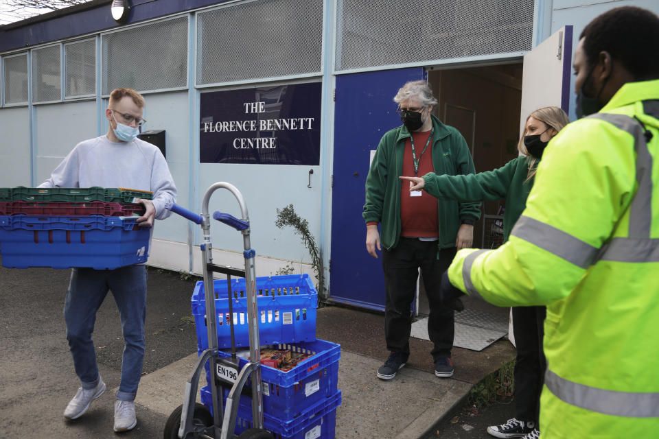 Workers and volunteers at Hackney Foodbank bank receive and organize food donations, 15th of December 2021, Hackney, East London, United Kingdom. The Hackney Food Bank is part of a nationwide network of foodbanks, supported by The Trussell Trust, working to combat poverty and hunger across the UK. The food bank gives out three days emergency food supplies to families and individual who go hungry in the borrough. The food is all donated by individuals and the food donated is held in a small ware house where it is  sorted and packed for distribution.  More people than ever in Britain have turned to the food bank for help and in Hackney the need has gone up with 350% over the past two years. (photo by Kristian Buus/In Pictures via Getty Images)