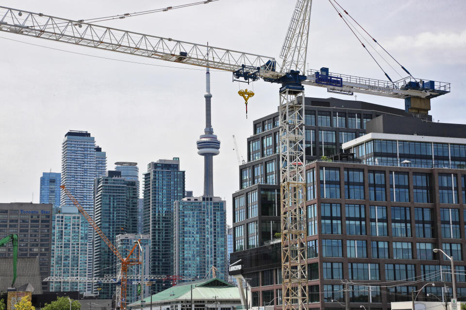 Construction cranes seen in front of skyscrapers in downtown Toronto, Ontario, Canada, on July 01, 2019. (Photo by Creative Touch Imaging Ltd./NurPhoto via Getty Images)