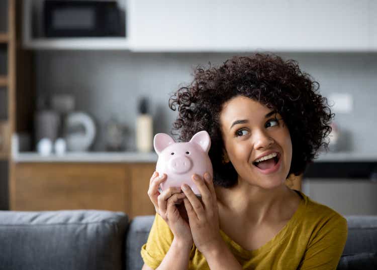 Woman ready to open her piggy bank