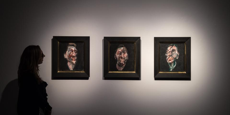A woman views Francis Bacon&#39;s &quot;Three Studies For A Portrait Of George Dyer&quot;