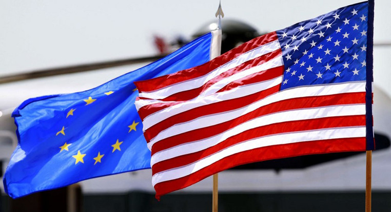The European Union and American flags are pictured 
