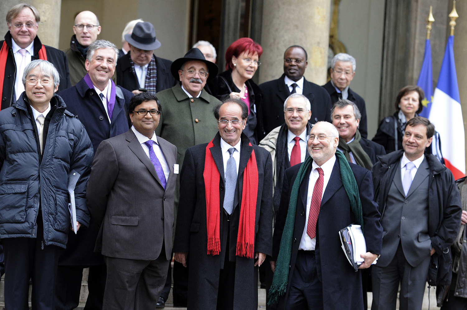 International economists including Persaud pose in front of the Elysee Palace in Paris on Jan. 6, 2011, after a working lunch with French President Nicolas Sarkozy to prepare for the G-20 meeting.