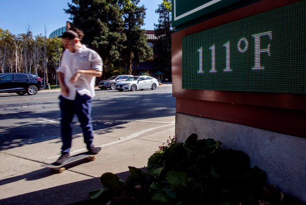 WALNUT CREEK, CALIFORNIA - SEPTEMBER 6: A skateboarder rolls down the hot sidewalks of Civic Drive in Walnut Creek, Calif., on Sept. 6, 2022 as temperatures rise to 111 degrees. (Karl Mondon/Bay Area News Group)