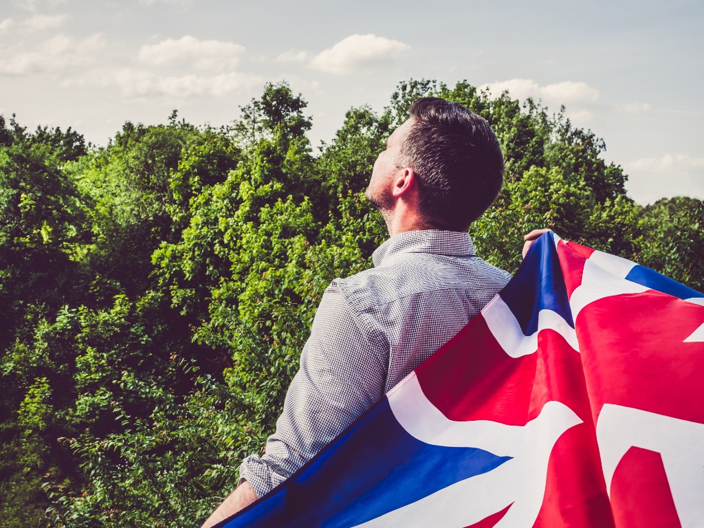 Young Man Waving British Flag