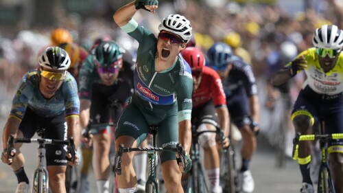 Belgium's Jasper Philipsen celebrates as he crosses the finish line to win the seventh stage of the Tour de France cycling race over 170 kilometers (105.5 miles) with start in Mont-de-Marsan and finish in Bordeaux, France, Friday, July 7, 2023. (AP Photo/Thibault Camus)
