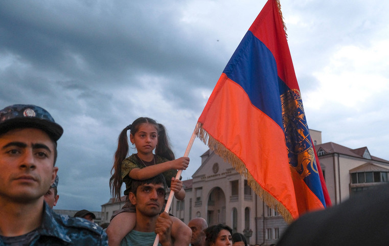 Demonstrators rally to demand the reopening of a blockaded road linking the Nagorno-Karabakh region to Armenia and to decry crisis conditions in the region.